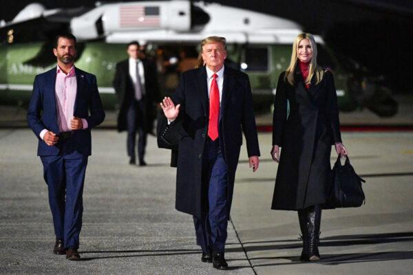  U.S. President Donald Trump, daughter Ivanka Trump, and son Donald Trump Jr., make their way to board Air Force One before departing from Dobbins Air Reserve Base in Marietta, Ga., on Jan. 4, 2021. (Mandel Ngan/AFP via Getty Images)