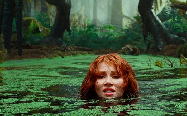 Claire Dearing (Bryce Dallas Howard) attempts to escape a giant dino-beast with sabre-like claws in "Jurassic World: Dominion." (Amblin Entertainment/Universal Pictures)