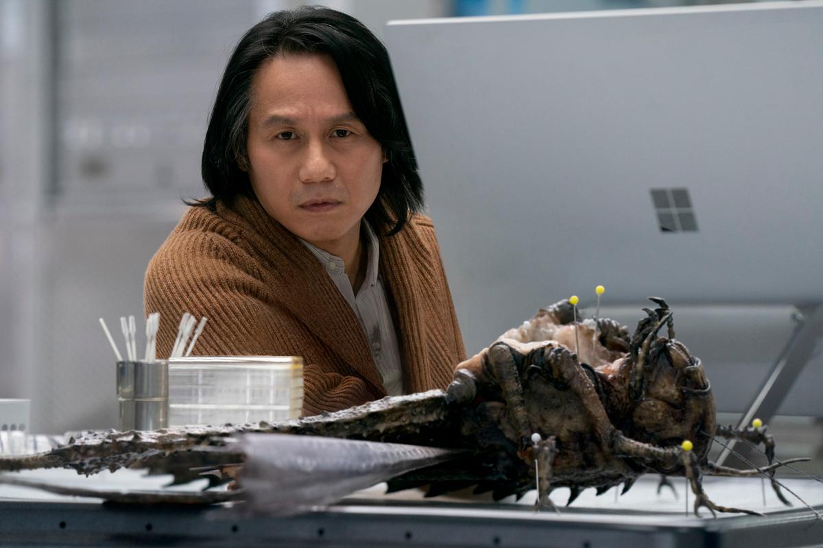 BD Wong as Dr. Henry Wu poses with a Jurassic megalocust in "Jurassic World: Dominion." (Amblin Entertainment/Universal Pictures)