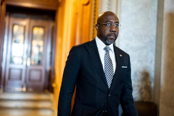 Sen. Raphael Warnock (D-Ga.) walks out of the Senate Chambers during a series of votes in the U.S. Capitol Building in Washington on May 11, 2022. (Anna Moneymaker/Getty Images)