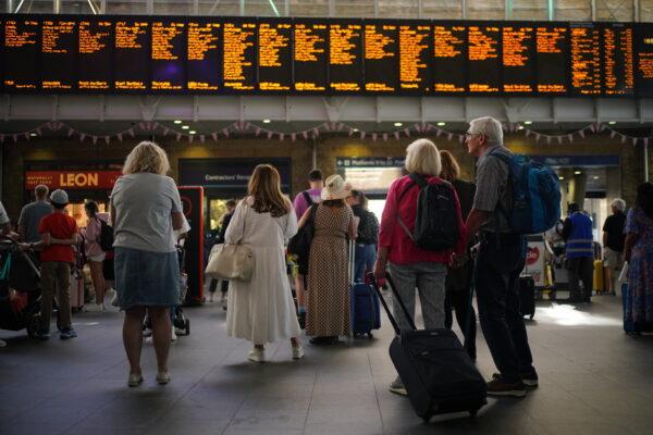 Train passengers, during first day of RMT strike, at London's Waterloo station on June 21, 2022. (Yui Mok/PA)