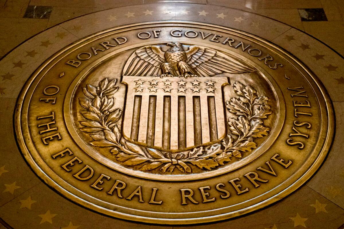 The seal of the Board of Governors of the United States Federal Reserve System is displayed in the ground at the Marriner S. Eccles Federal Reserve Board Building in Washington on Feb. 5, 2018. (Andrew Harnik/AP Photo)