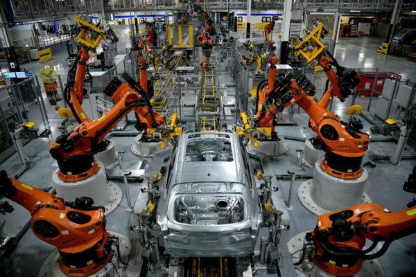 Autonomous robots assemble an X model SUV at the BMW manufacturing facility in Greer, S.C., on Nov. 4, 2019. (Charles Mostoller/Reuters)