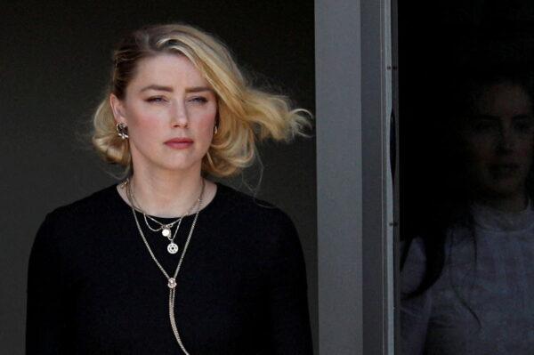 Amber Heard leaves Fairfax County Circuit Courthouse after the jury announced split verdicts in the Depp v. Heard civil defamation trial at the Fairfax County Circuit Courthouse in Fairfax, Va., on June 1, 2022. (Tom Brenner/Reuters)