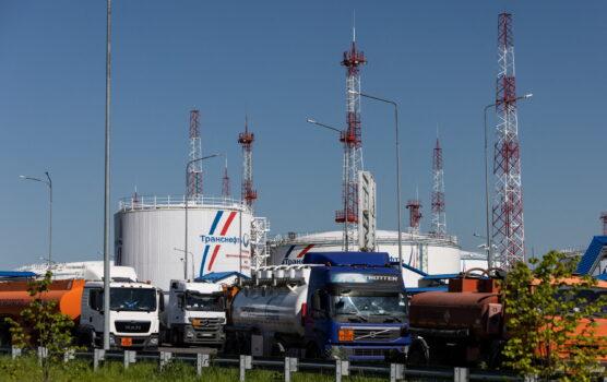 Petrol trucks are parked near oil tanks at Volodarskaya LPDS production facility owned by Transneft oil pipeline operator in the village of Konstantinovo in the Moscow region, Russia, on June 8, 2022. (Maxim Shemetov/Reuters)