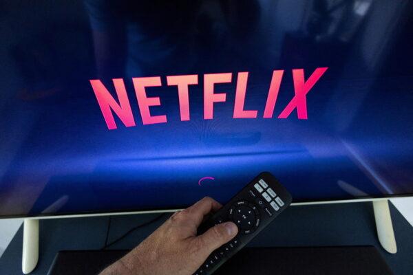 A Netflix logo on a TV screen, ahead of a Swiss vote on a referendum called "Lex Netflix," in a photo illustration taken on May 9, 2022. (Denis Balibouse/Reuters)