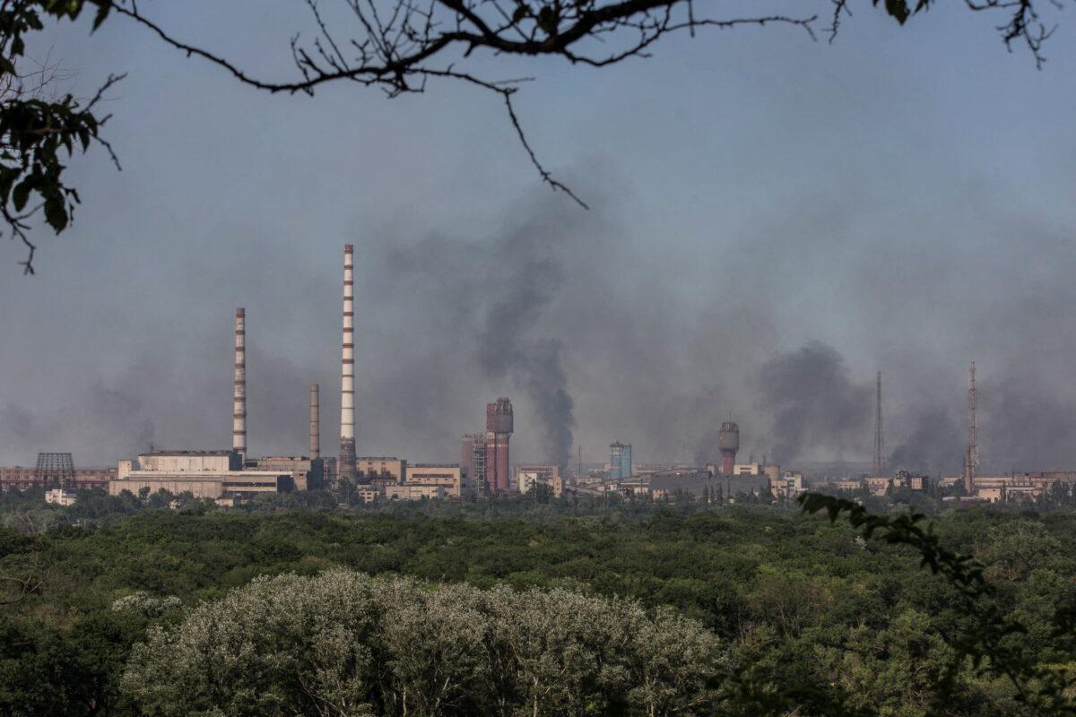 Smoke rises after a military strike on a compound of Sievierodonetsk's Azot Chemical Plant in the town of Lysychansk, Luhansk region, Ukraine, on June 10, 2022. (Oleksandr Ratushniak/Reuters)