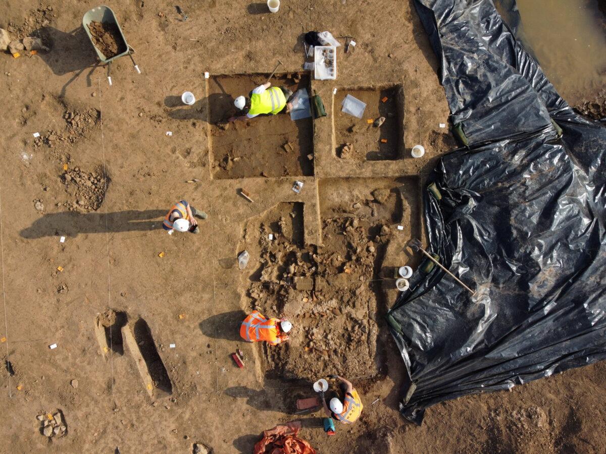 People work on a site where archaeologists discovered a Roman temple in Zevenaar, central-east Netherlands, on March 21, 2022. (RAAP/Handout via Reuters)