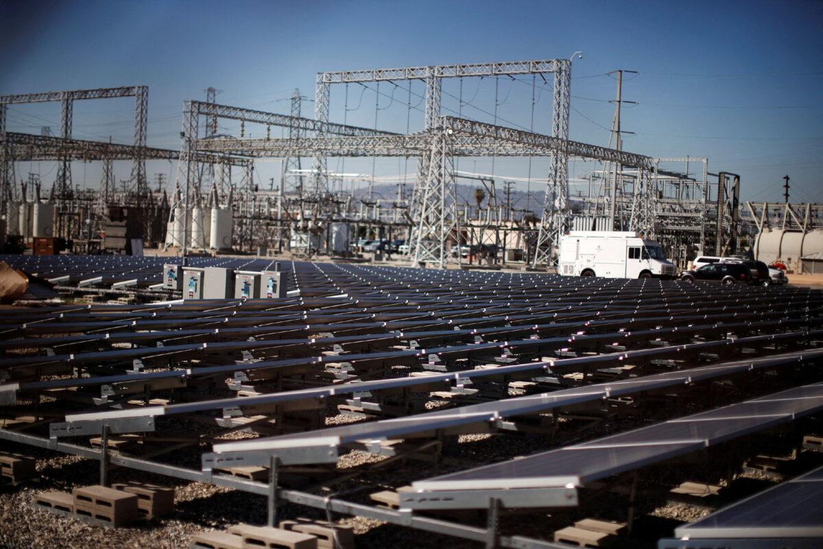 Solar panels are seen next to a Southern California Edison electricity station in Carson, Calif., on March 4, 2015. (Lucy Nicholson//File Photo/Reuters)