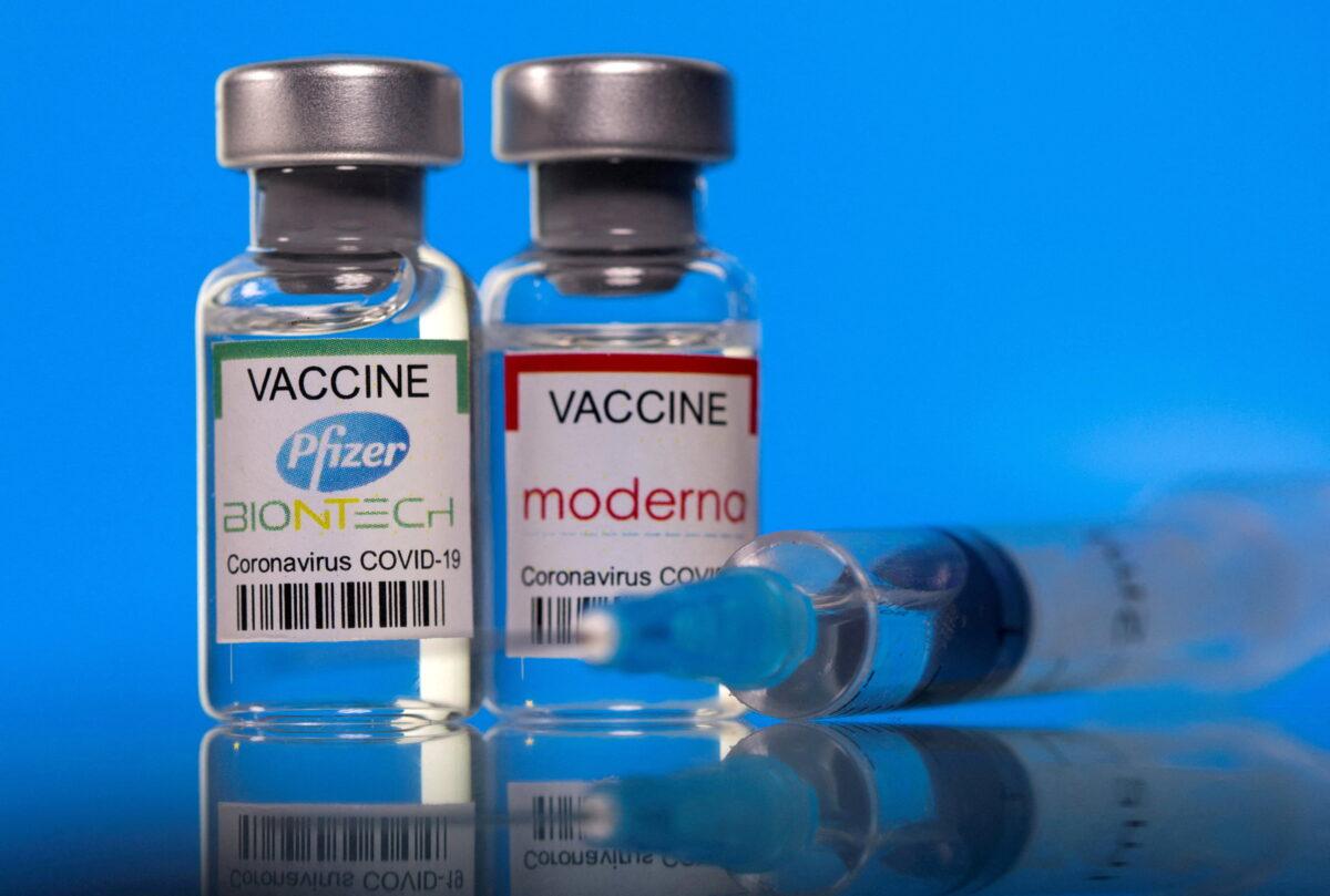 Vials with Pfizer-BioNTech and Moderna COVID-19 vaccine labels, in an illustration picture taken on March 19, 2021. (Dado Ruvic//Reuters)