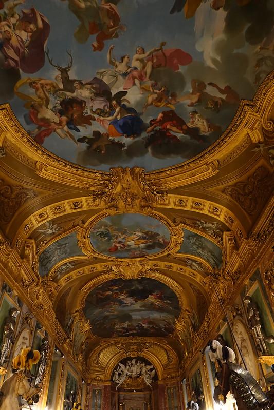 The spectacular oil-painted ceiling of the Royal Armory features scenes depicting stories of Aeneas and the famous painting “Allegory of the Life of Man.” Painted by Claudio Francesco Beaumont, the paintings stretch down the hall on the coved ceiling which is paneled with sophisticated cartouche framing and gorgeous gold-painted stucco work. (Guilhem Vellut/CC BY 2.0)