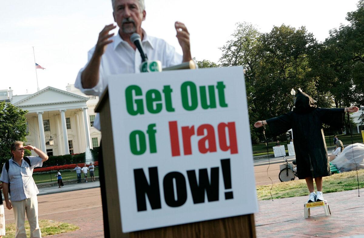 Tom Hayden (C), co-founder of Progressive Democrats of America, speaks during an anti-war rally at Lafayette Park in front of the White House in Washington on Sept. 15, 2005. (Alex Wong/Getty Images)