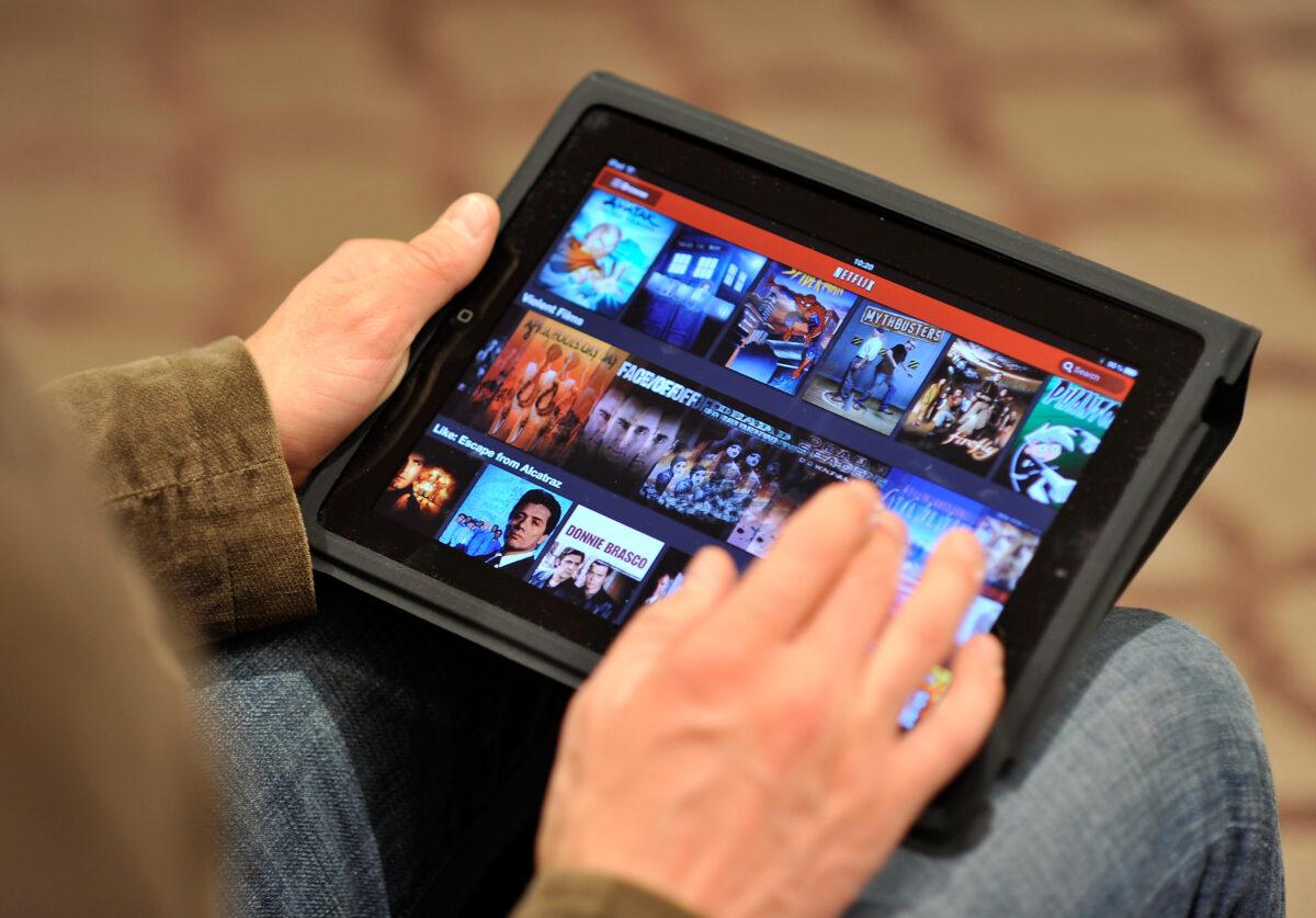 An Apple iPad is used to view Netflix during the Netflix UK launch in London on Jan. 9, 2012. (Gareth Cattermole/Getty Images for Netflix)