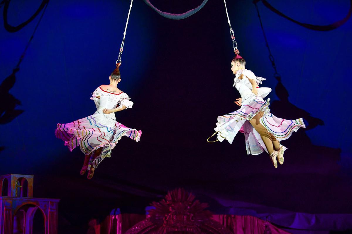  Daniela and Isabella Munoz Landestoy from the Havana Circus Company suspended by their hair in a dancing act from "Carpa." (Courtesy of Giffords Circus)