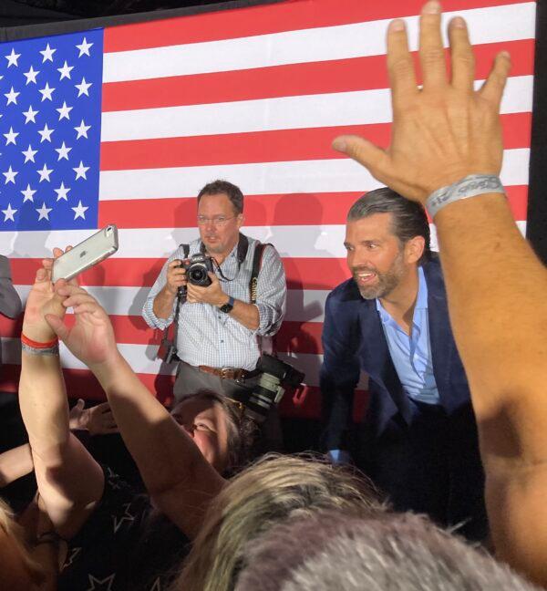 America First supporters crowd the stage seeking selfies and handshakes from Donald Trump Jr. at a rally for Republican U.S. Senate candidate Adam Laxalt and Nevada Governor frontrunner Joe Lombardo at Stoney’s Rockin’ County in Las Vegas on June 10. Trump Jr. headlined an assembly of MAGA notables who spoke in support of Laxalt and Lombardo the last weekend before the state’s June 14 primaries. (John Haughey/The Epoch Times)