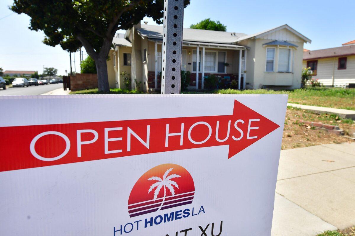A sign points toward an open house in Alhambra, Calif., on May 4, 2022. The Fed announced its biggest interest rate hike in more than 20 years as it deals with fast-rising prices in the U.S. economy. (Frederic J. Brown/AFP via Getty Images)