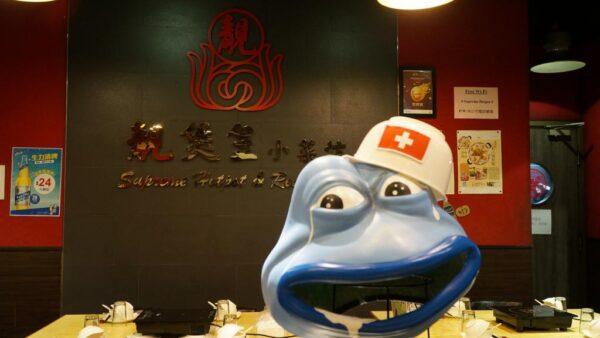One of the symbols of the Anti-Extradition Law Movement, the Pepe the Frog Helmet,  was placed in front of Supreme Hot Pot. (Courtesy of the restaurant owner William)