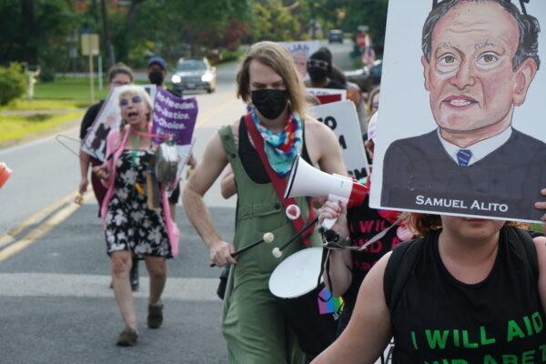 Pro-abortion protesters march to Supreme Court Justice Samuel Alito's neighborhood in Fairfax, Va., on June 13, 2022. (Jackson Elliott/The Epoch Times)