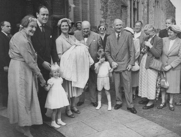 British Prime Minister Winston Churchill attends the christening of his grandson Jeremy Soames at Westerham Parish Church in Kent in 1952. (Front, L–R) Clementine Churchill holding the hand of Emma Soames, Christopher Soames, Mary Soames (holding the baby), Winston Churchill, and the baby's godfather Field Marshal Montgomery, holding the hand of Nicholas Soames. (FPG/Archive Photos/Getty Images)