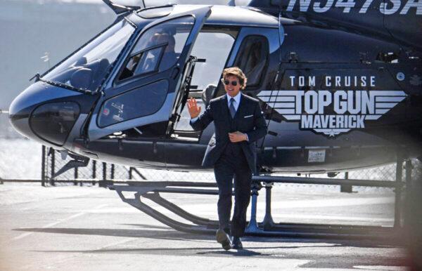 Actor Tom Cruise arrives in a helicopter to the world premiere of "Top Gun: Maverick" aboard the USS Midway in San Diego, Calif., on May 4, 2022. (Robyn Beck/AFP via Getty Images)