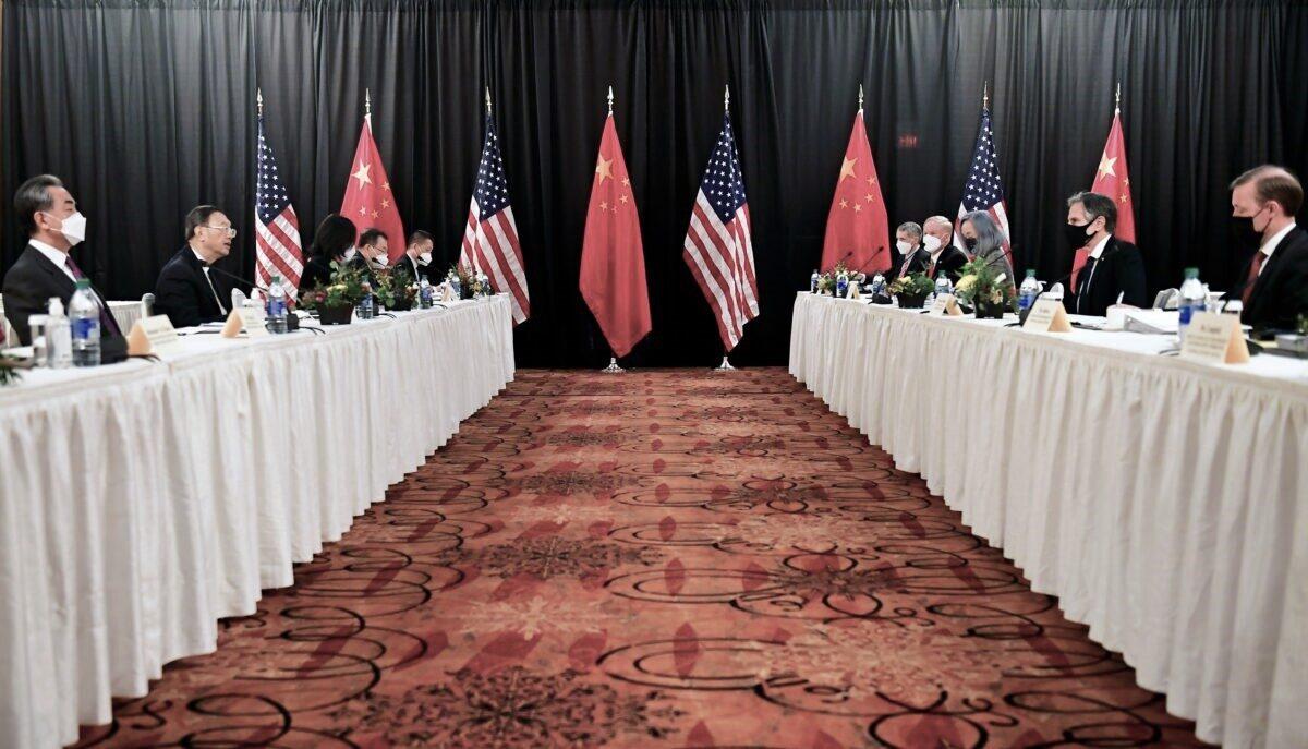 U.S. Secretary of State Antony Blinken (2nd R), joined by national security adviser Jake Sullivan (R), speaks while facing Yang Jiechi (2nd L), director of the Central Foreign Affairs Commission Office, and Wang Yi (L), China's state councilor and foreign minister, at the opening session of U.S.-China talks at the Captain Cook Hotel in Anchorage, Alaska, on March 18, 2021. (Frederic J. Brown/Pool via Reuters)
