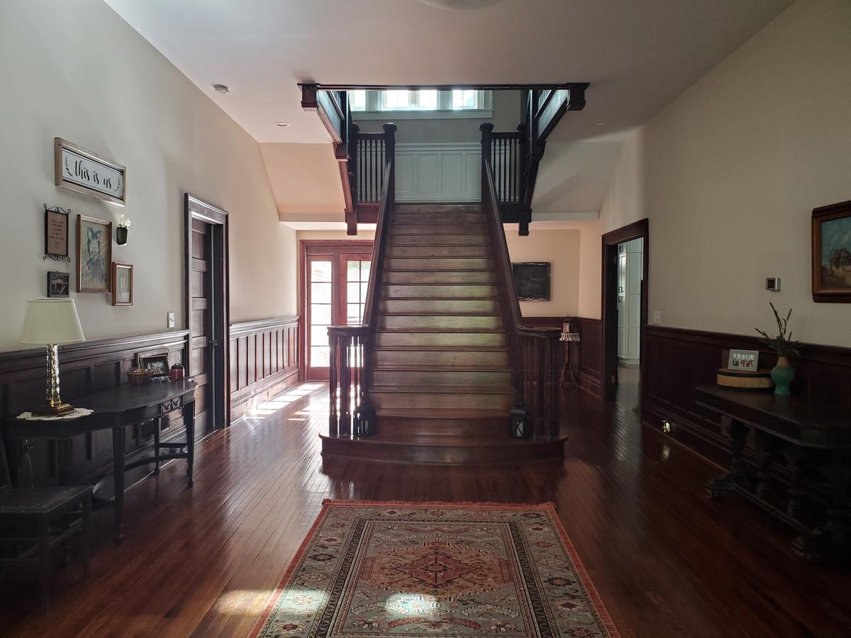 The renovated foyer. (Courtesy of <a href="https://www.instagram.com/turningthepagemansion/">Trey and Abby</a>)