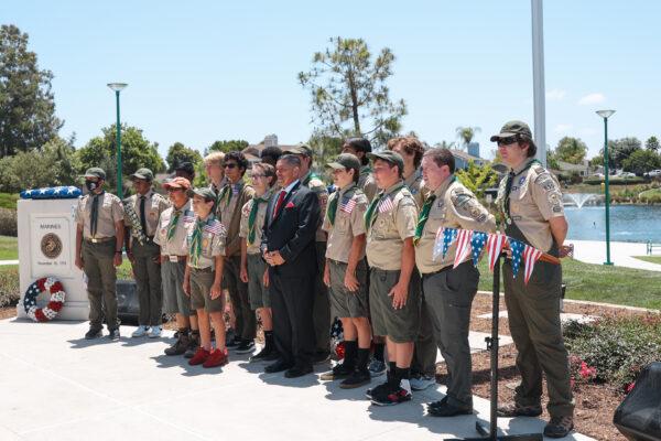 Boy Scout Troop 628 and Lake Forest Mayor Robert Pequeño present the American flag at a celebration for Flag Day at Veterans Park in Lake Forest, Calif., on June 14, 2022. (Julianne Foster/The Epoch Times)
