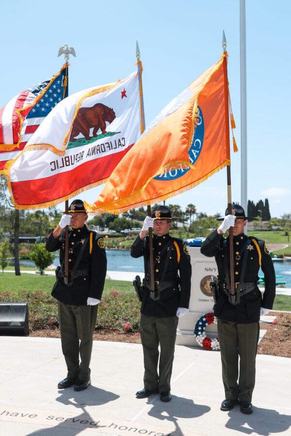 Orange County Sheriff’s Department color guard salutes in Lake Forest, Calif., on June 14, 2022. (Julianne Foster/The Epoch Times)
