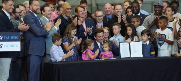 Florida Gov. Ron DeSantis signs HB 7065 to combat fatherlessness in the state of Florida on April 11, 2022. (Courtesy of The Governor's Office)<span style="font-size: 16px;"> </span>