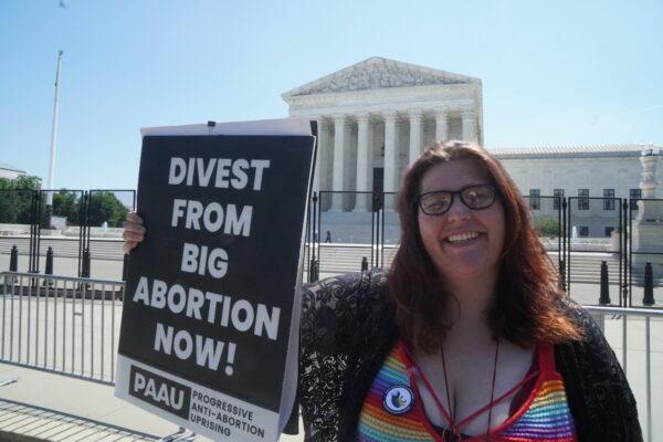 Left-wing pro-life protester Lauren Handy, the director of activism with Progressive Anti-Abortion Uprising, protests outside the U.S. Supreme Court on June 15, 2022 (Jackson Elliott/The Epoch Times)
