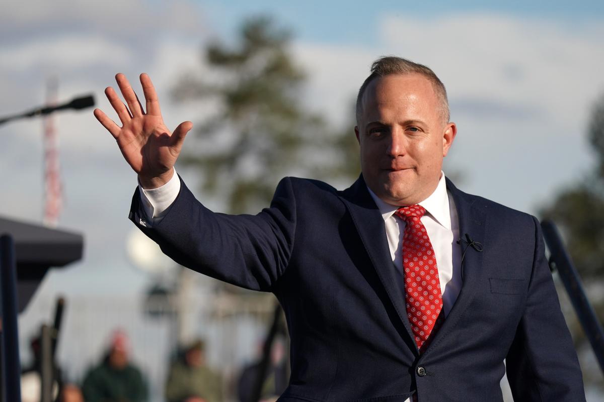  House of Representatives candidate Russell Fry waves to a crowd during a rally with former President Donald Trump at the Florence Regional Airport in Florence, S.C., on March 12, 2022. (Sean Rayford/Getty Images)