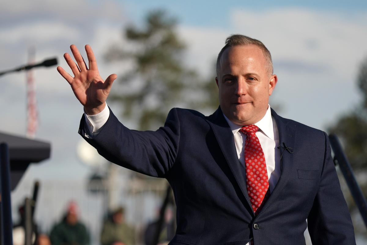 House of Representatives candidate Russell Fry waves to a crowd during a rally with former President Donald Trump at the Florence Regional Airport in Florence, S.C., on March 12, 2022. (Sean Rayford/Getty Images)