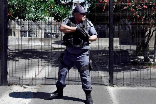 An armed South African police officer responds to a shooting of two alleged gang members in Manenberg on October 18, 2017 in Cape Town.<br/>(Pieter Bauermeister/AFP via Getty Images)