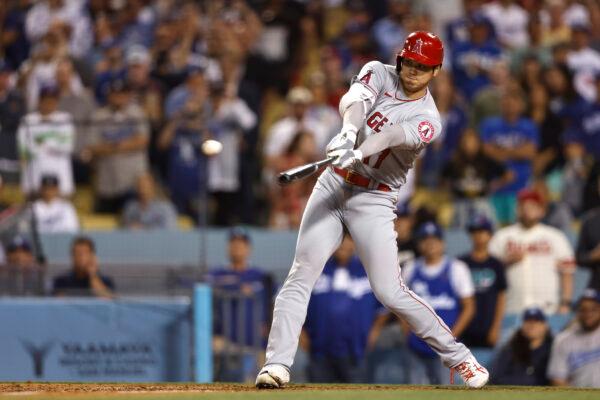 Shohei Ohtani #17 of the Los Angeles Angels hits a triple against the Los Angeles Dodgers during the ninth inning at Dodger Stadium, in Los Angeles, on June 15, 2022. (Michael Owens/Getty Images)