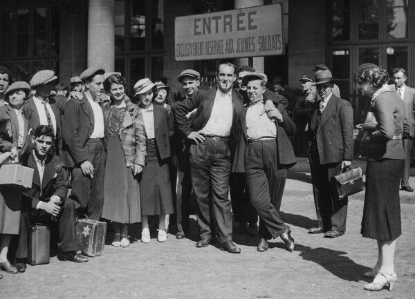 French recruits leave for their barracks from the Gare de l'Est in Paris during World War II, circa 1940. (FPG/Hulton Archive/Getty Images)