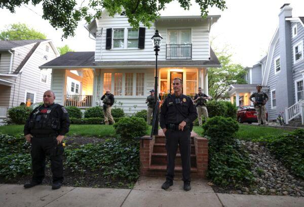 Police stand outside the home of Associate Justice Brett Kavanaugh as pro-abortion advocates protest in Chevy Chase, Md., on May 11, 2022. (Kevin Dietsch/Getty Images)