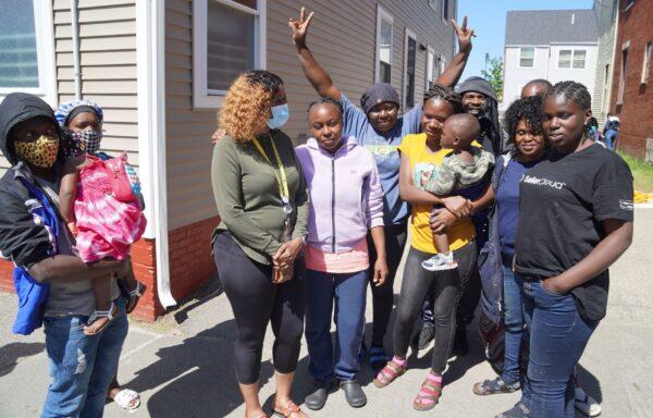 A group of asylum-seekers warehoused in an alley in Portland, Maine, on May 25, 2022. (Steven Kovac/The Epoch Times)