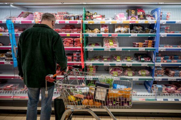 A customer shops for meat at a Sainsbury's supermarket in Walthamstow, east London, on Feb. 13, 2022. (Tolga Akmen /AFP via Getty Images)