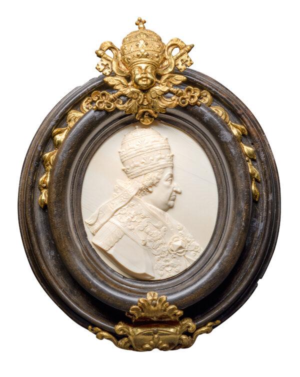 "Portrait of Pope Clement XI, Rome," circa 1710, by an unknown artist after a medal by Charles Claude Dubut. Ivory, wooden frame, gilded brass, softwood; 4 inches by 3 3/8 inches. The Reiner Winkler Ivory Collection, at the Liebieghaus Sculpture Collection in Frankfurt, Germany. (Liebieghaus Sculpture Collection)