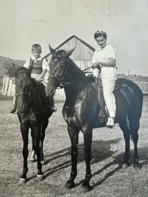 Dan Novacovici (L) and his mother, Lucia (riding racehorse Dolina), on his great-aunt's 100-hectare farm estate outside of Bucharest in 1944. (Courtesy of Dan Novacovici)
