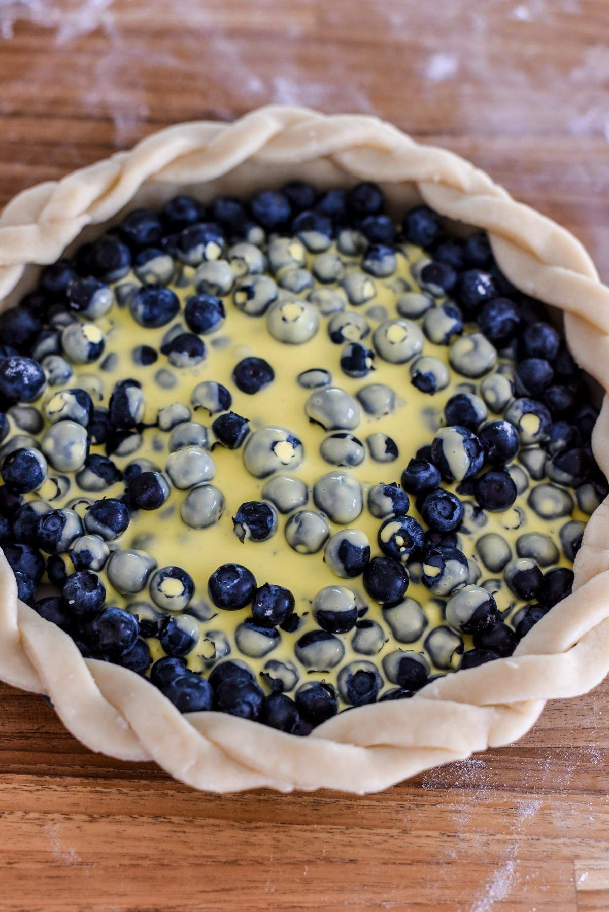 Pour the migaine over the blueberries and toss to evenly coat. (Audrey Le Goff)