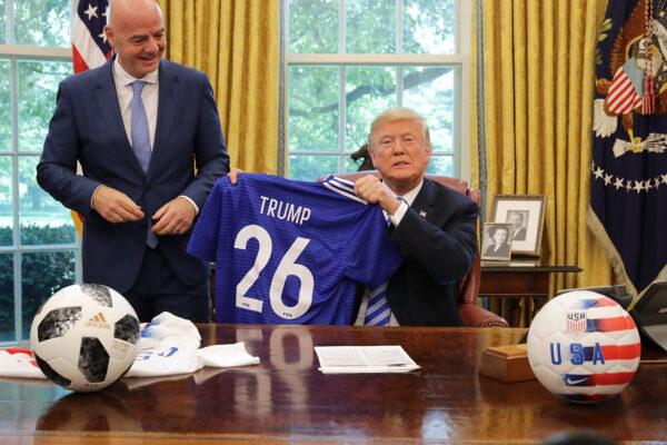 U.S. President Donald Trump poses for photographs with FIFA President Gianni Infantino following announcement of the U.S., Canada, and Mexico bids accepted for the 2026 FIFA World Cup,  in the Oval Office at the White House, in D.C., on August 28, 2018. (Getty Images)
