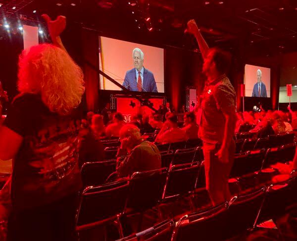  Delegates at the Texas GOP state convention in Houston on June 17, 2022, gave U.S. Sen. John Cornyn a thumbs down for working with Democrats to incentivize red flag laws. (Darlene McCormick Sanchez/The Epoch Times)