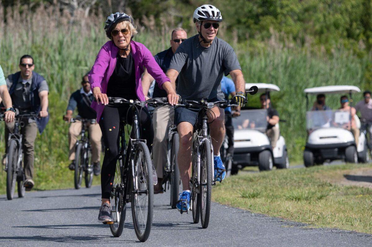 President Joe Biden and First Lady Jill Biden ride their bicycles at Gordon's Pond State Park in Rehoboth Beach, Delaware, on June 18, 2022. (Saul Loeb/AFP/Getty Images)