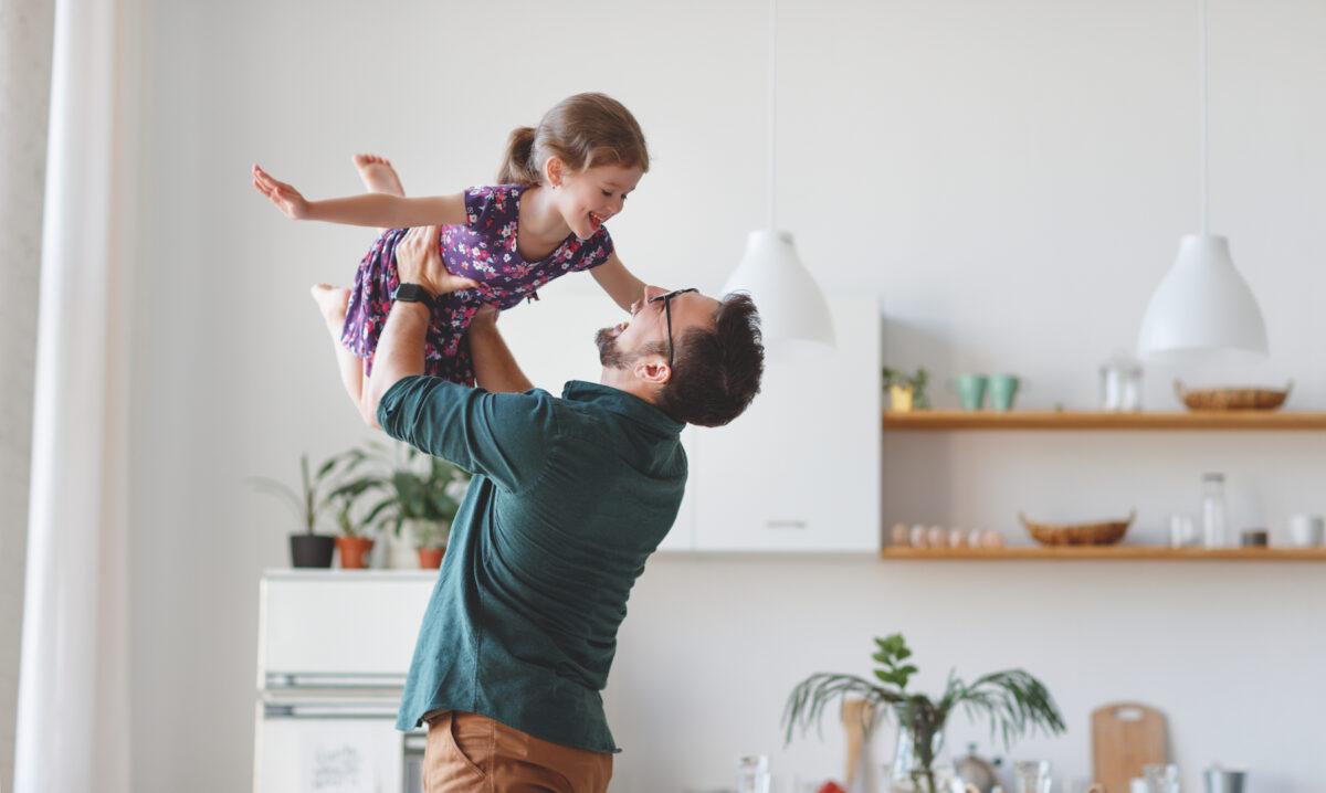 A dad plays with his daughter. (Evgeny Atamanenko/Shutterstock)