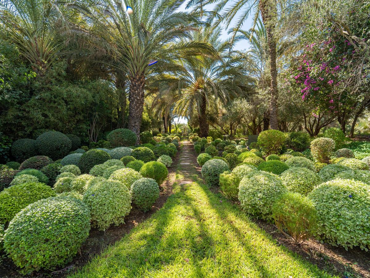 The caretaker’s job is not an easy one. Maintaining 11 acres of Eden-perfect gardens requires time and dedication. (Courtesy of Morocco Sotheby's International Realty)