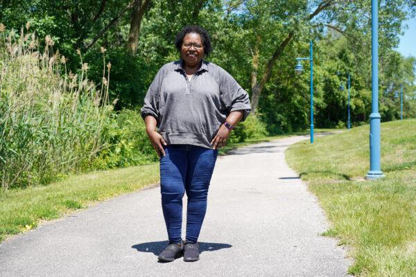 Pamela Peterson stands in a park near her workplace in Moline, part of the Quad Cities area in western Illinois, on June 11, 2022. (Cara Ding/The Epoch Times)