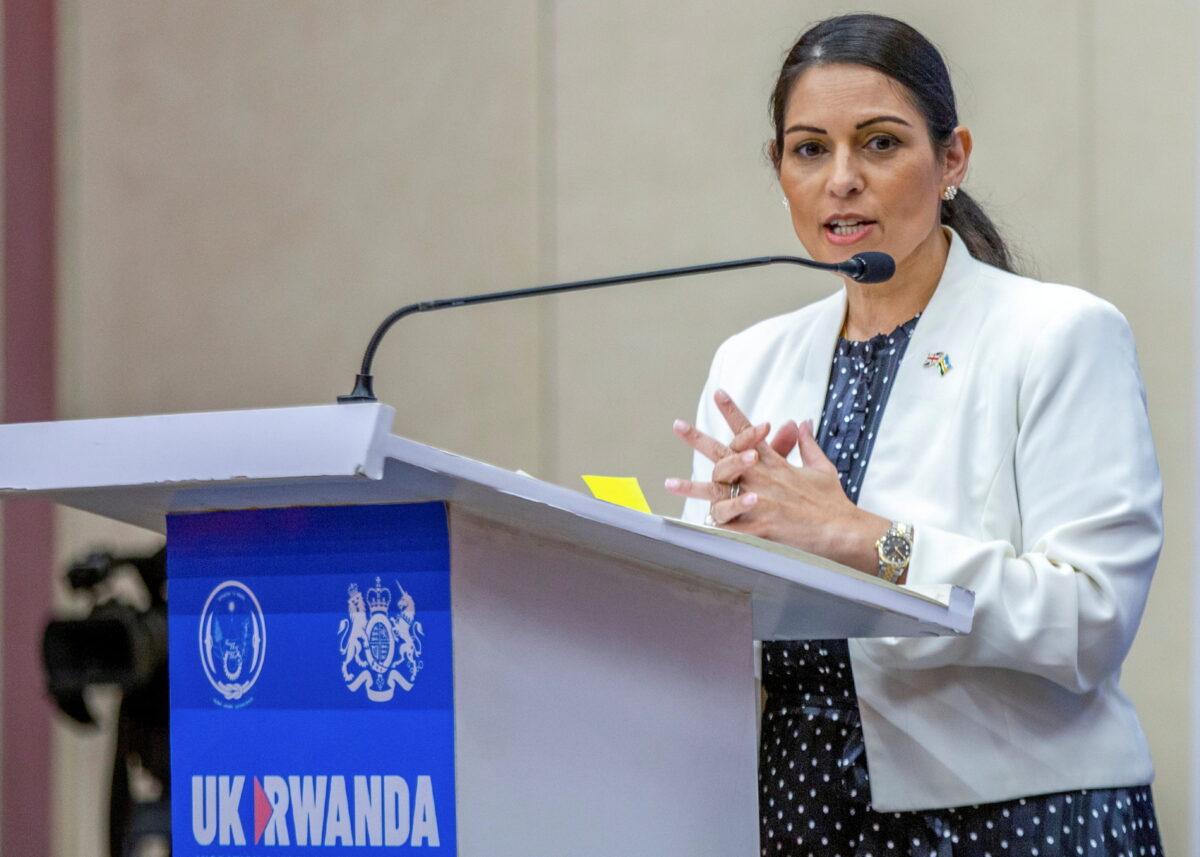 British Home Secretary Priti Patel addresses a joint news conference with Rwandan Foreign Minister Vincent Biruta, after signing the partnership agreement in Kigali, Rwanda, on April 14, 2022. (Jean Bizimana/Reuters)