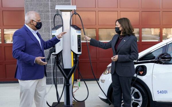 U.S. Vice President Kamala Harris speaks with SemaConnect CEO Mahi Reddy at the Prince George's County Brandywine Maintenance Facility during a visit to announce the Biden administration’s Electric Vehicle Charging Action Plan, in Brandywine, Maryland, on Dec. 13, 2021. (Kevin Lamarque/Reuters)