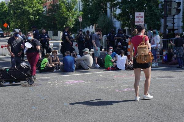 Police surround the U.S. Supreme Court as Shut Down DC protesters attempt to block it off in Washington, DC on June 13, 2022. (Jackson Elliott/The Epoch Times)